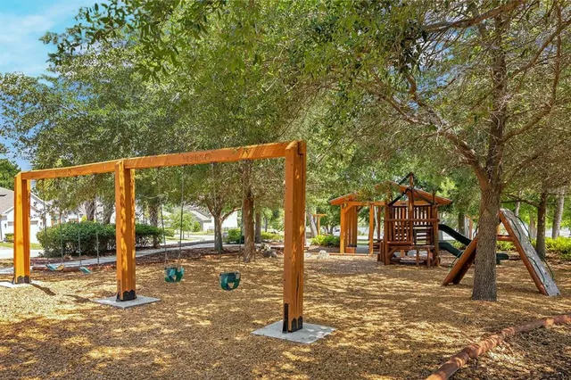 a swimming pool with outdoor seating and yard