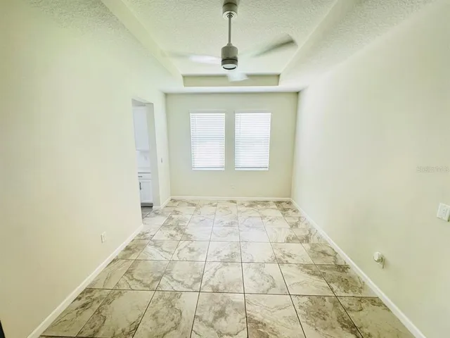 a view of an empty room and window