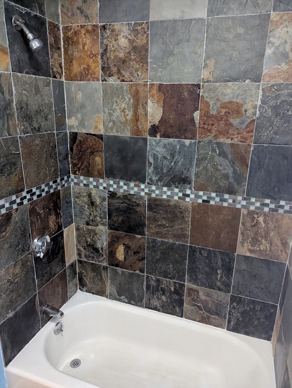 176 Hillside Street, Unit 101 Boston, MA 02120 - Photo 16 of 20 a bathroom with a shower and a sink