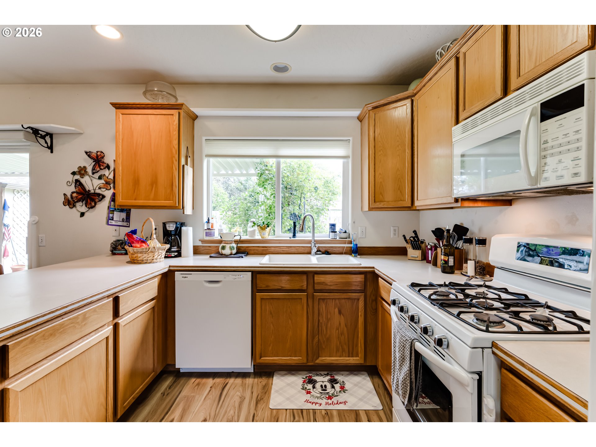 3513 Kendra Street Eugene, OR 97404 - Photo 16 of 45 a kitchen with a sink stove top oven and cabinets