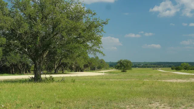 a view of a golf course with a lake