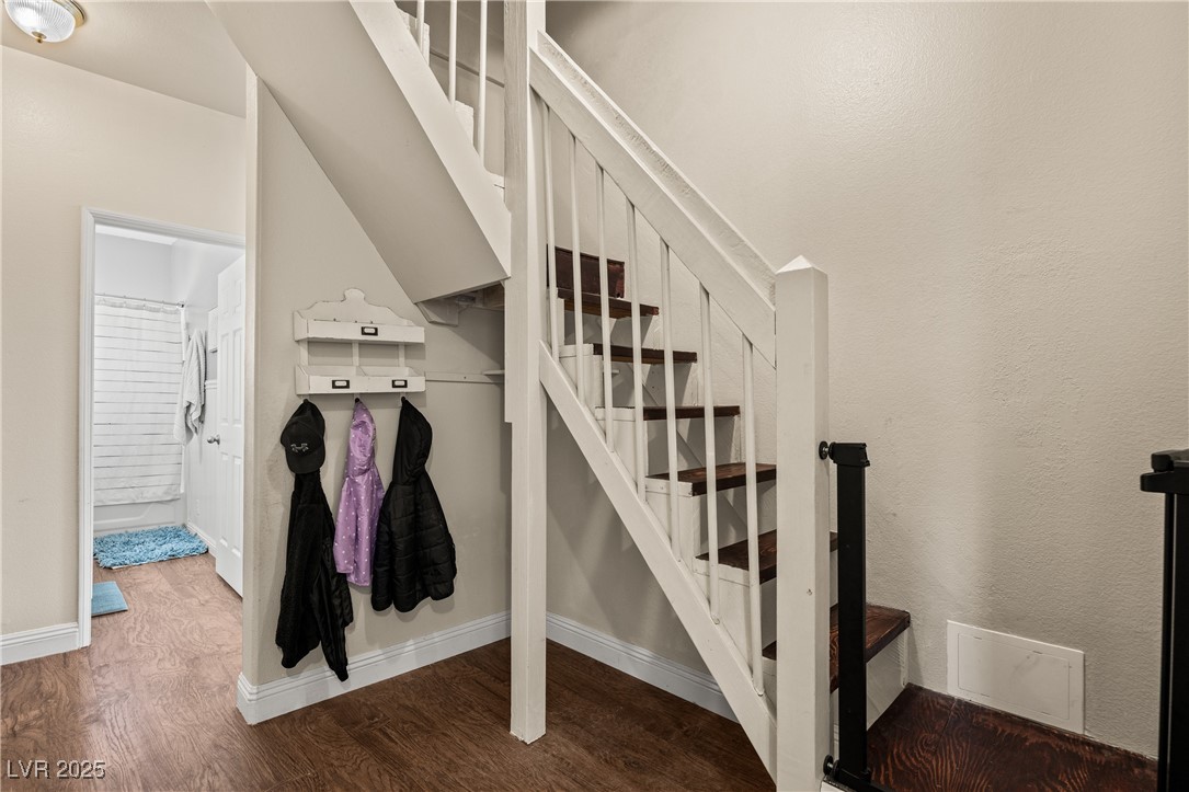 1951 Jim Haworth Court Logandale, NV 89021 - Photo 26 of 63 Stairs with baseboards and wood finished floors