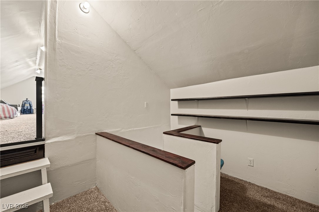 1951 Jim Haworth Court Logandale, NV 89021 - Photo 29 of 63 vaulted ceiling and carpet flooring