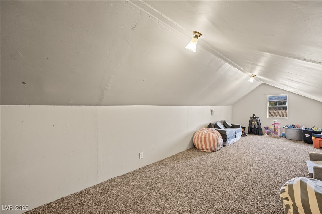 1951 Jim Haworth Court Logandale, NV 89021 - Photo 31 of 63 Additional living space featuring carpet floors and vaulted ceiling