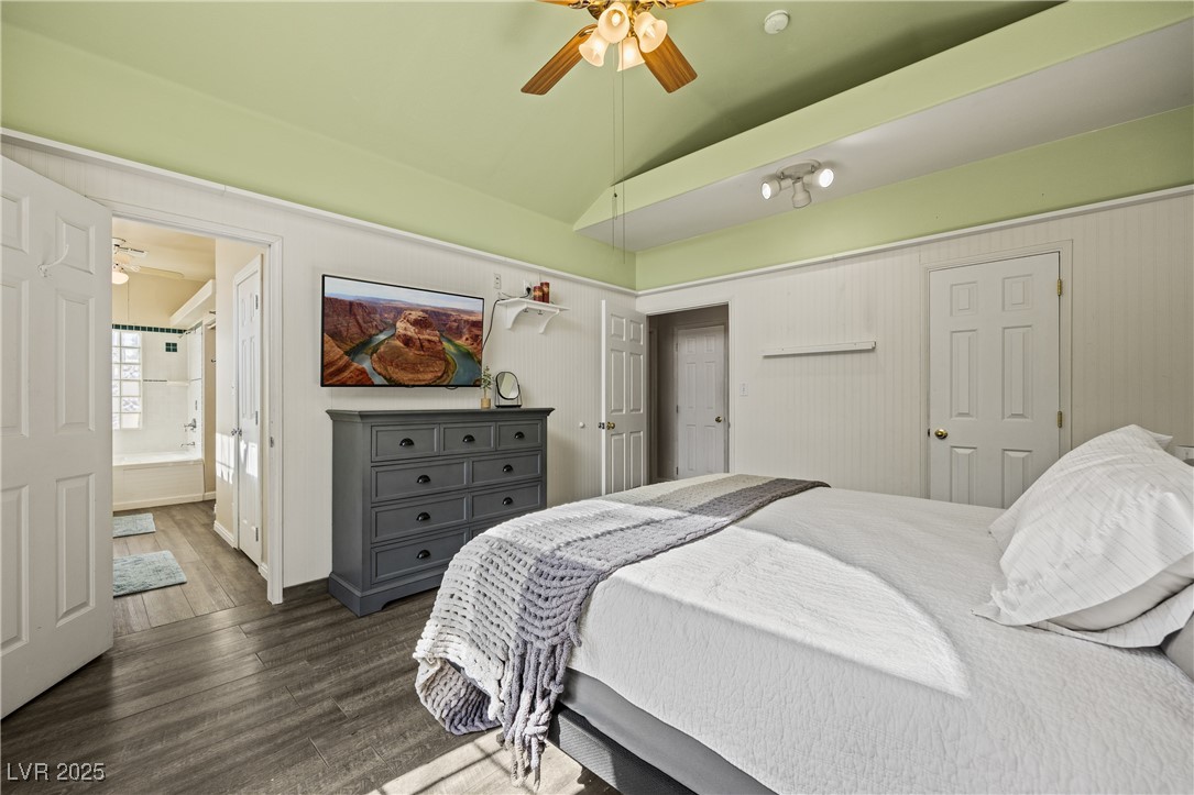 1951 Jim Haworth Court Logandale, NV 89021 - Photo 35 of 63 Bedroom featuring lofted ceiling, ceiling fan, connected bathroom, and dark wood-style flooring