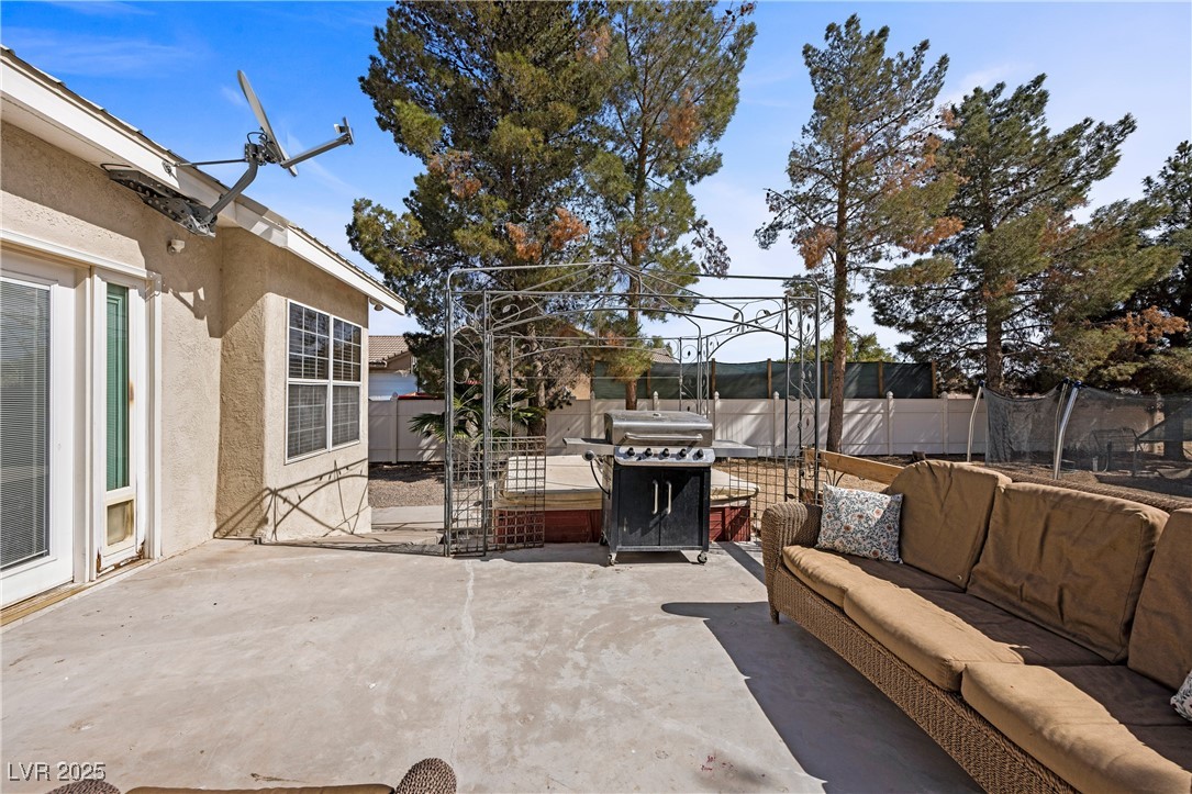 1951 Jim Haworth Court Logandale, NV 89021 - Photo 50 of 63 View of patio / terrace featuring a trampoline, a fenced backyard, outdoor lounge area, and grilling area