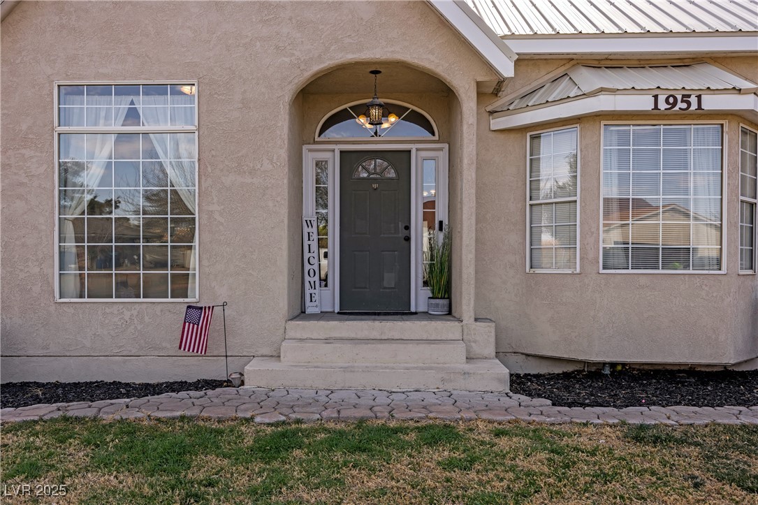 1951 Jim Haworth Court Logandale, NV 89021 - Photo 8 of 63 Entrance to property featuring metal roof and stucco siding