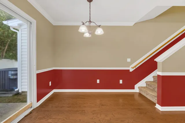 a view of an empty room with windows