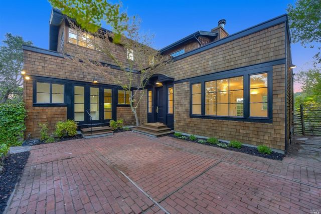 a view of yellow house with a porch