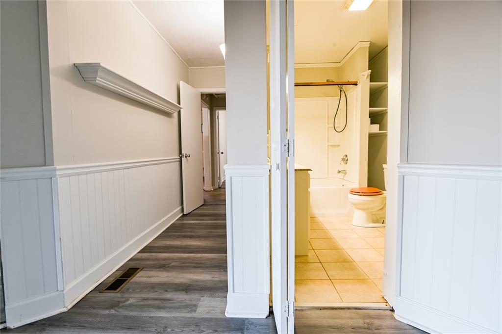 458 Haley Road Jackson, GA 30233 - Photo 22 of 47 a bathroom with a glass shower door