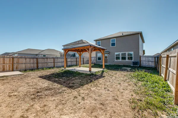 a house view with a backyard space