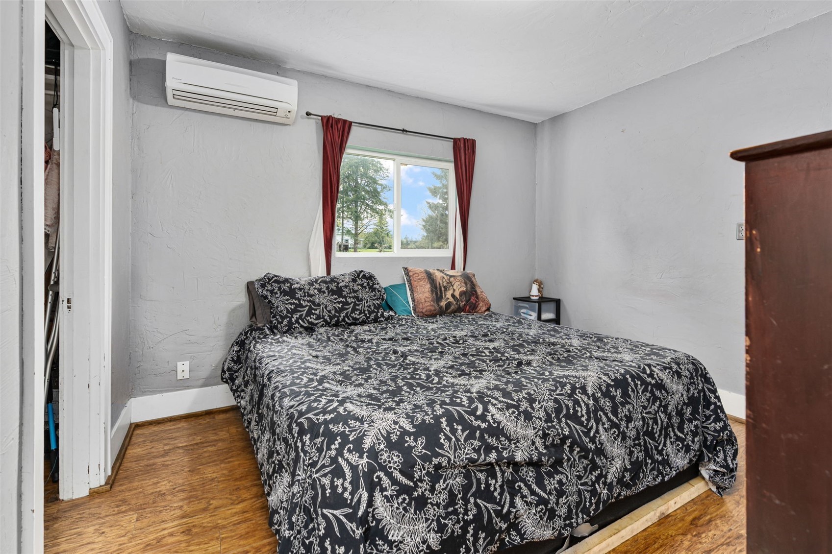 104 Reinseth Road Winlock, WA 98596 - Photo 12 of 35 a bed sitting in a bedroom next to a window