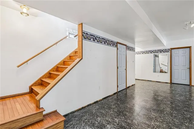 a view of balcony with wooden floor