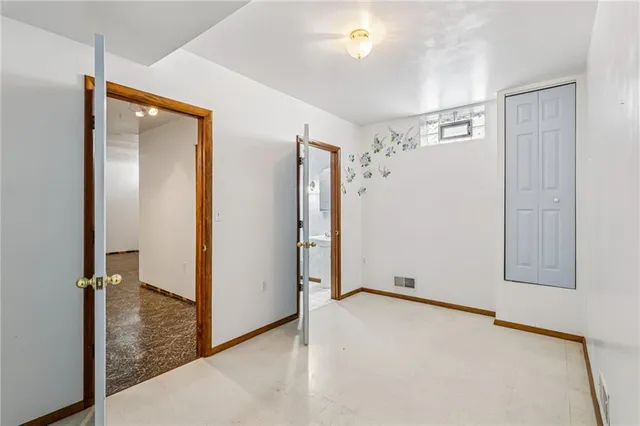 a bathroom with a shower and a sink