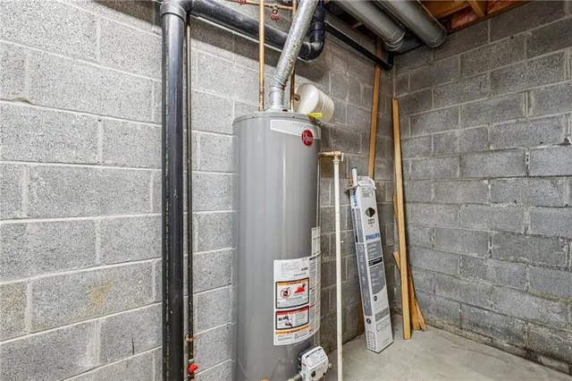 a view of a white house with a sink and a yard