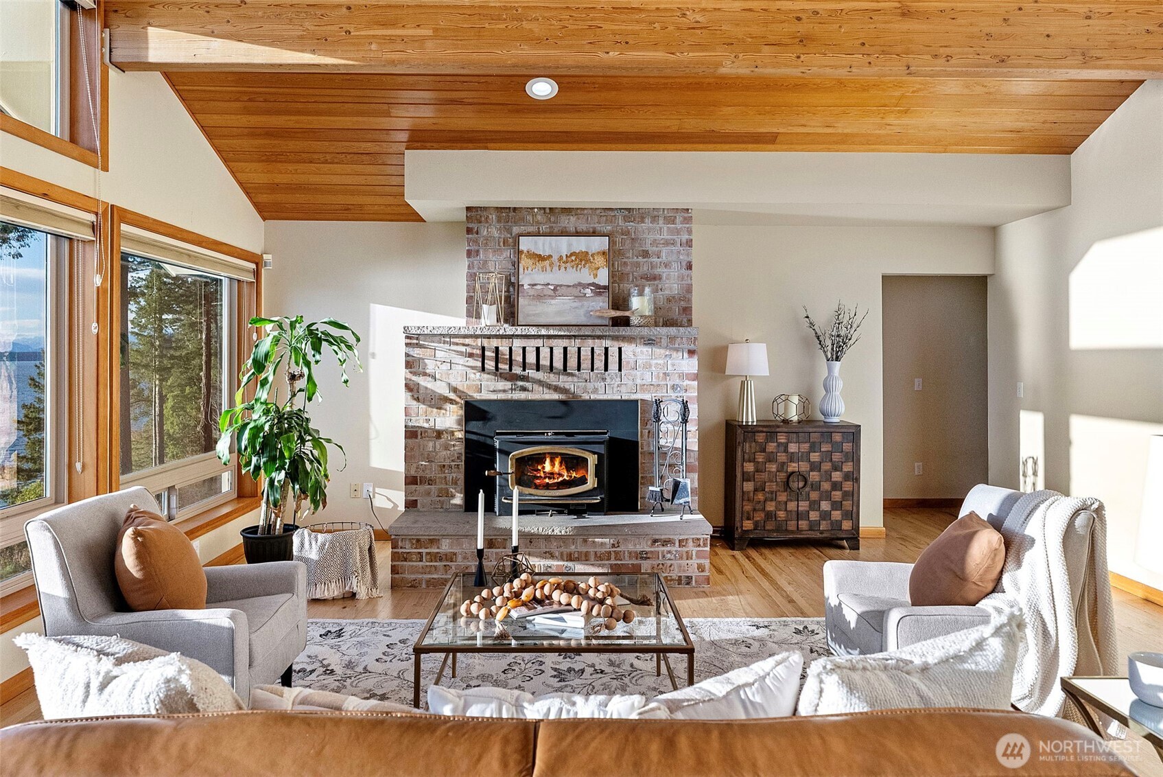17510 88th Street Southwest Longbranch, WA 98351 - Photo 11 of 40 a living room with furniture large window and a fireplace