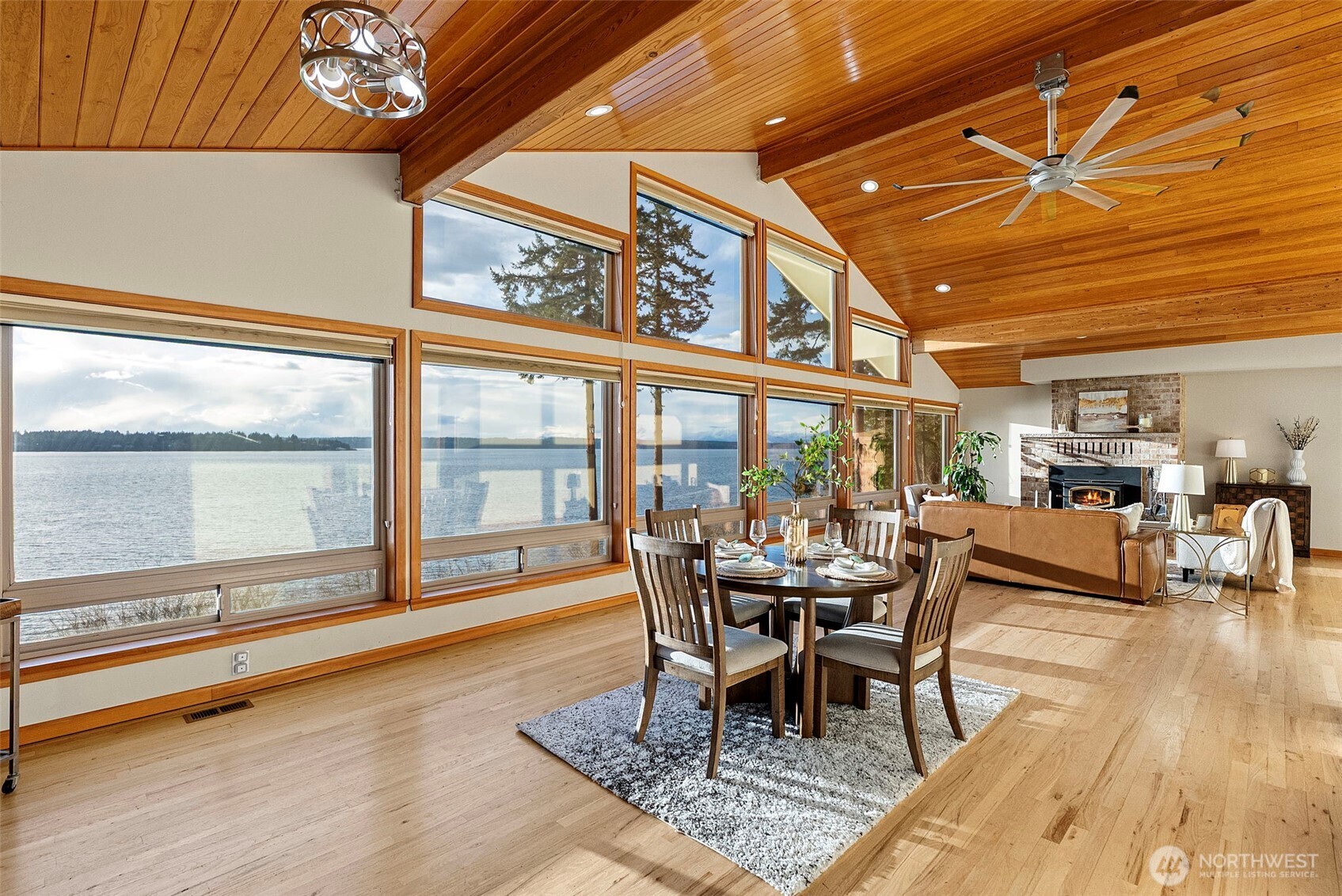 17510 88th Street Southwest Longbranch, WA 98351 - Photo 13 of 40 a dining room with furniture a chandelier and wooden floor