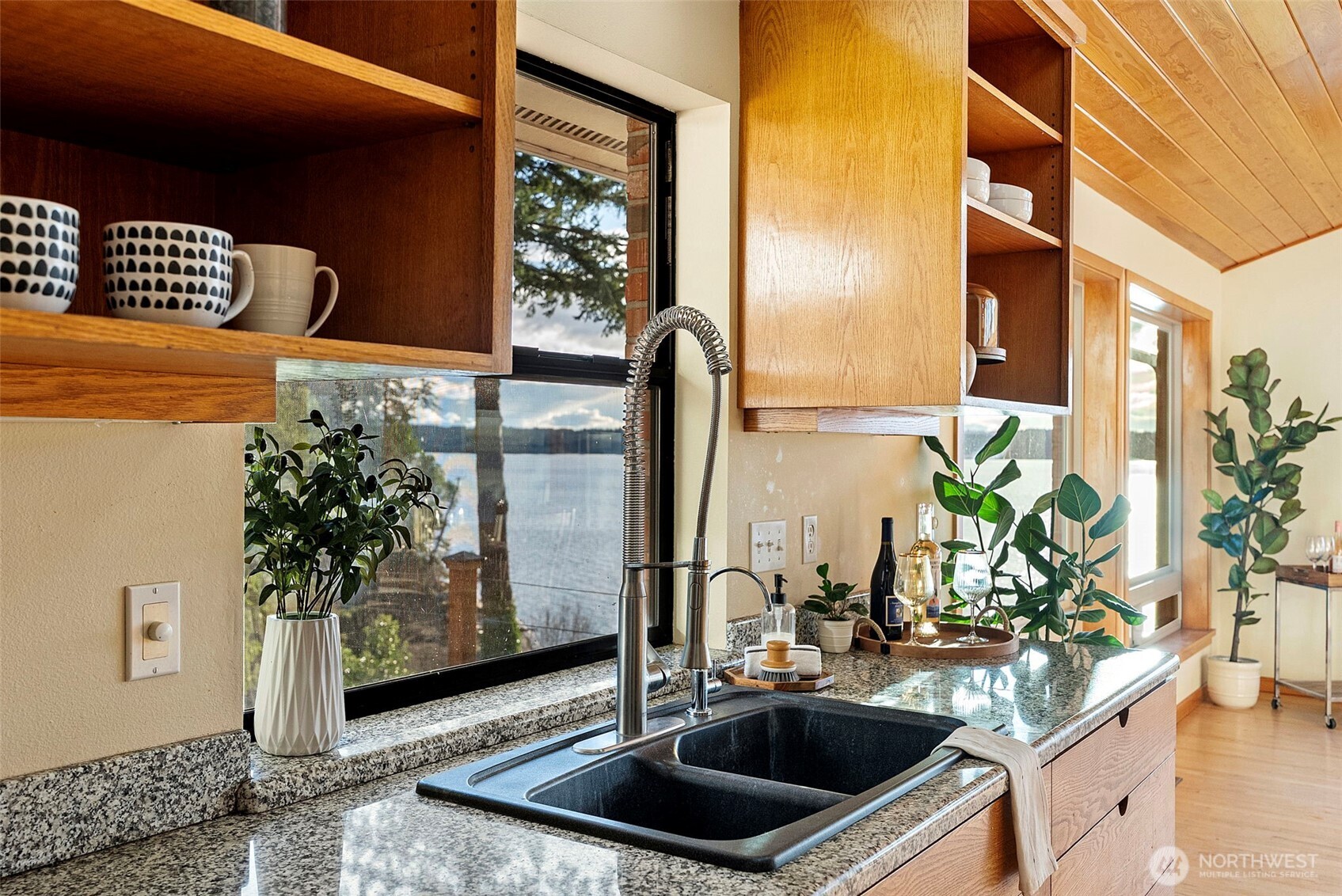 17510 88th Street Southwest Longbranch, WA 98351 - Photo 16 of 40 a kitchen with a sink a counter top space and a potted plant