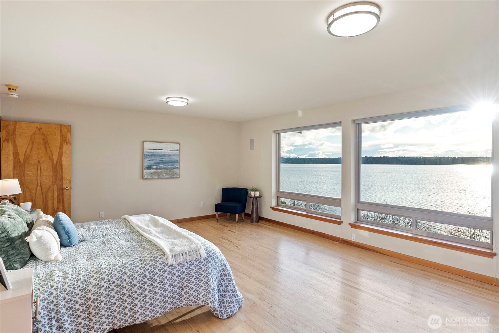 17510 88th Street Southwest Longbranch, WA 98351 - Photo 18 of 40 a bedroom with a bed and a large window