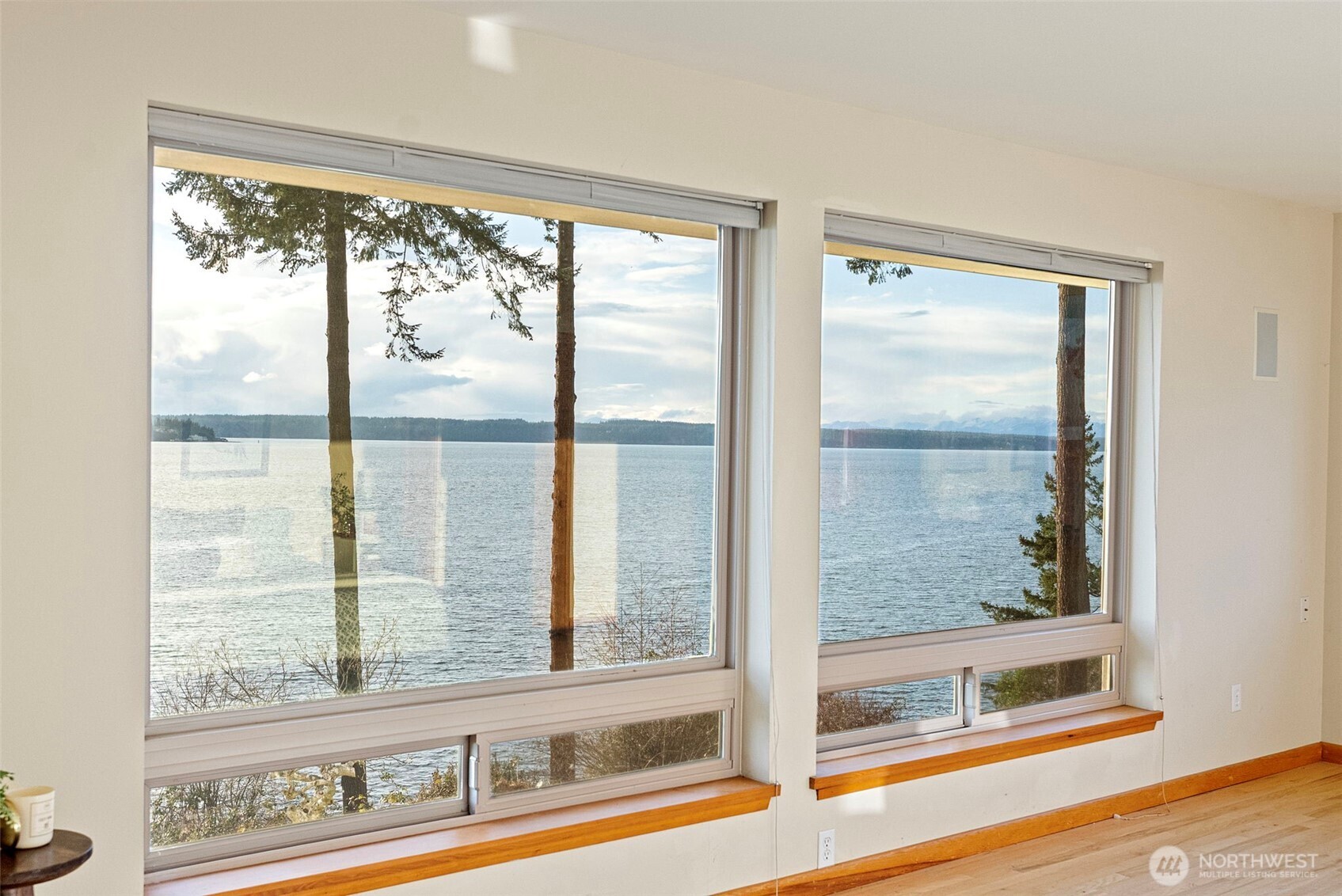 17510 88th Street Southwest Longbranch, WA 98351 - Photo 20 of 40 a view of a room that has a large window and a bed