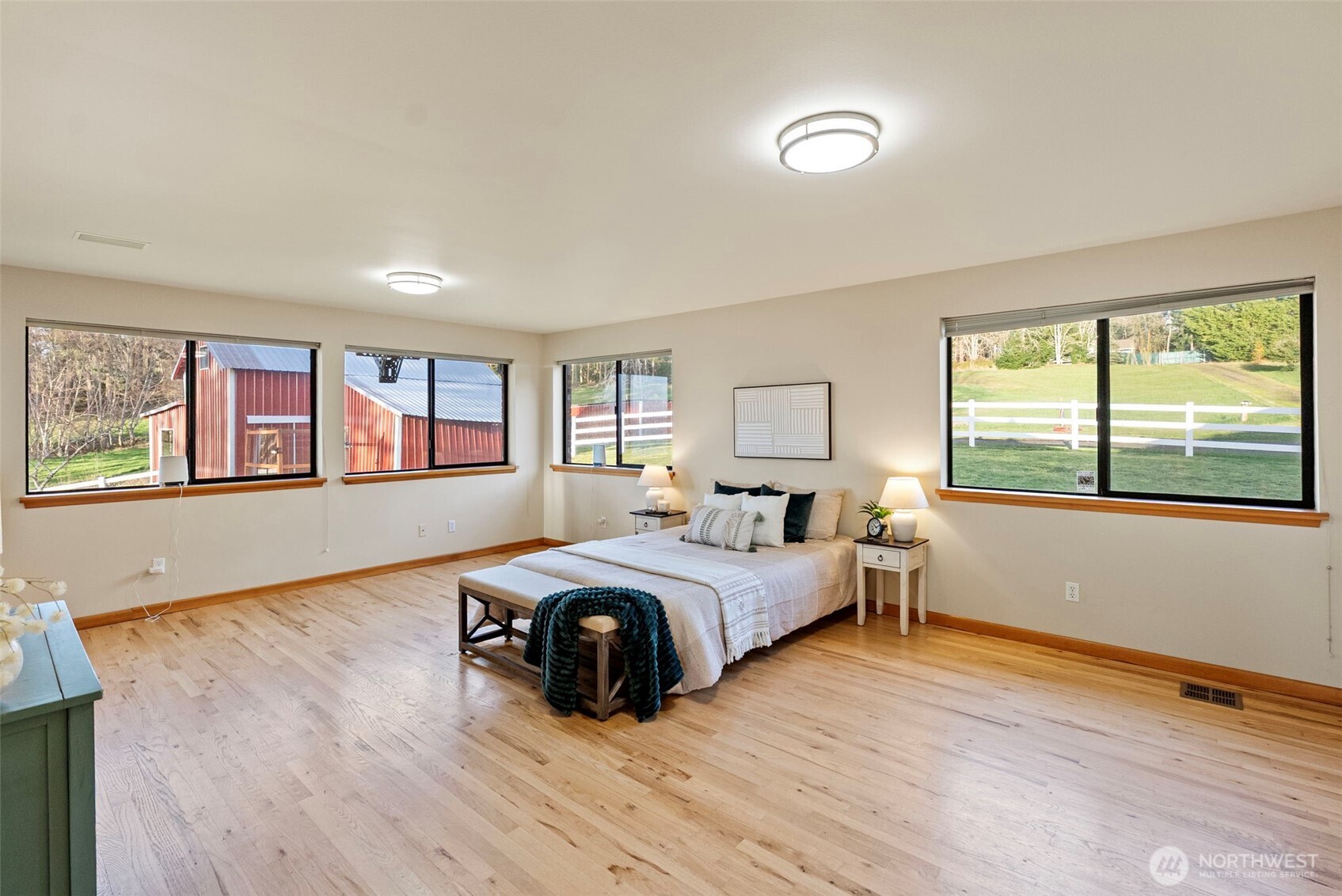 17510 88th Street Southwest Longbranch, WA 98351 - Photo 22 of 40 a spacious bedroom with a bed and a large window