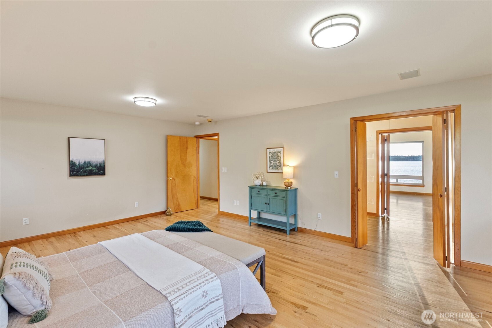 17510 88th Street Southwest Longbranch, WA 98351 - Photo 23 of 40 a bedroom with a bed and wooden floor
