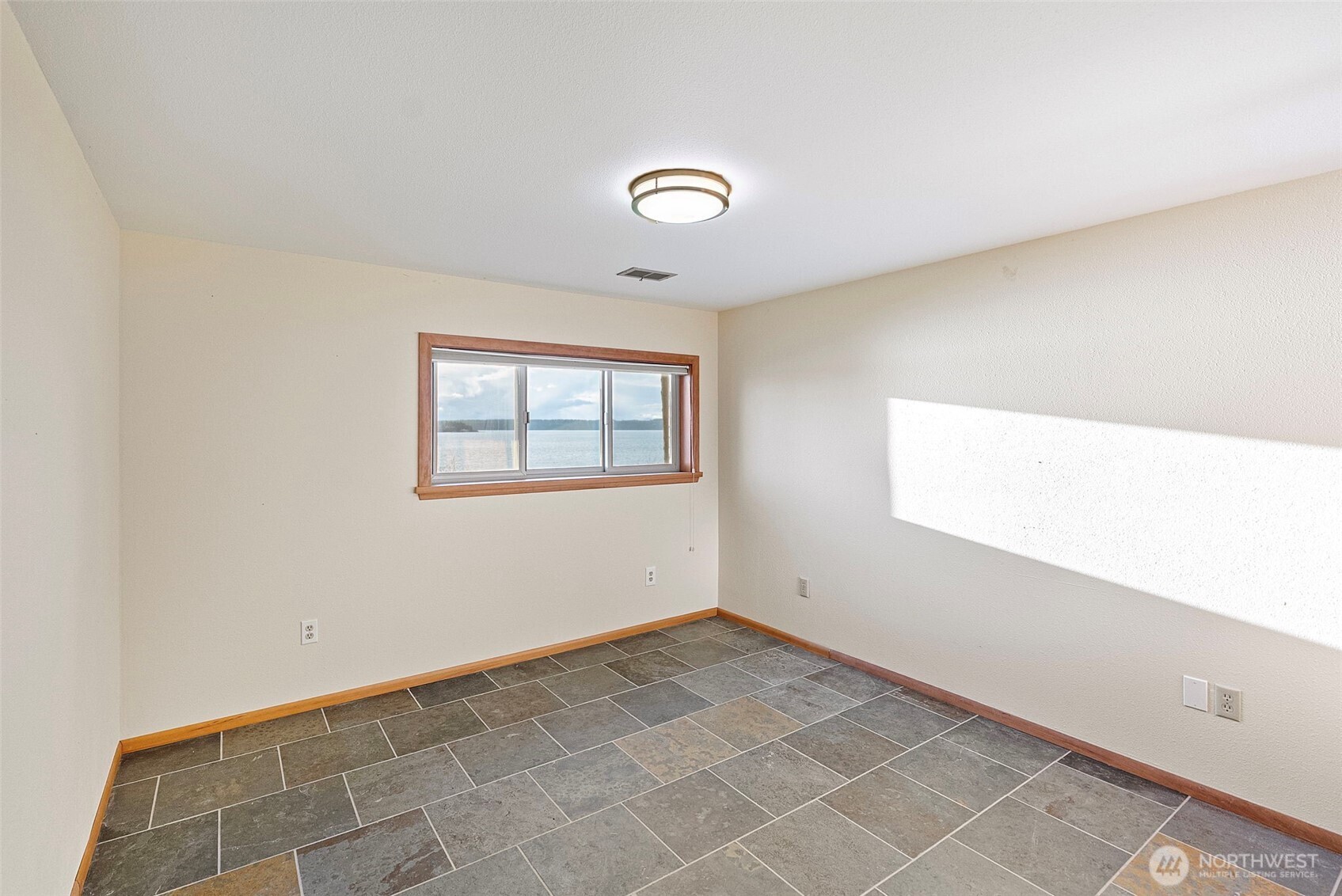 17510 88th Street Southwest Longbranch, WA 98351 - Photo 26 of 40 a view of an empty room with a window