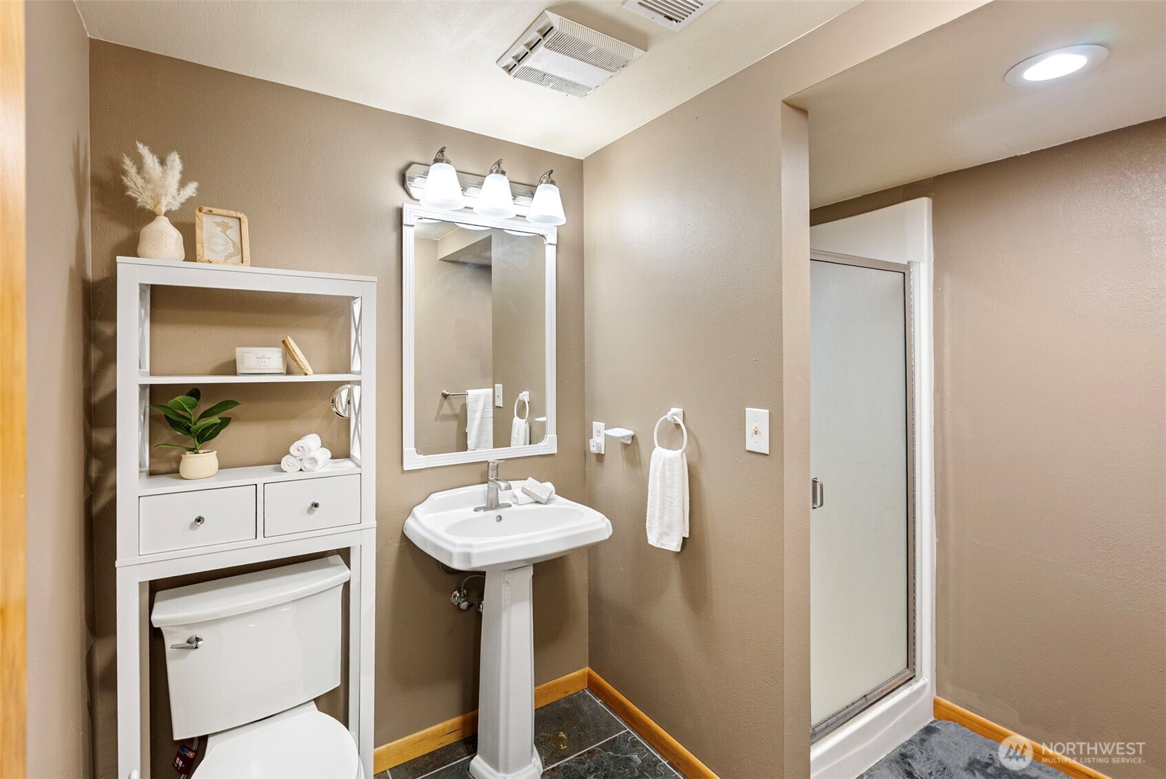 17510 88th Street Southwest Longbranch, WA 98351 - Photo 27 of 40 a bathroom with a sink and a mirror