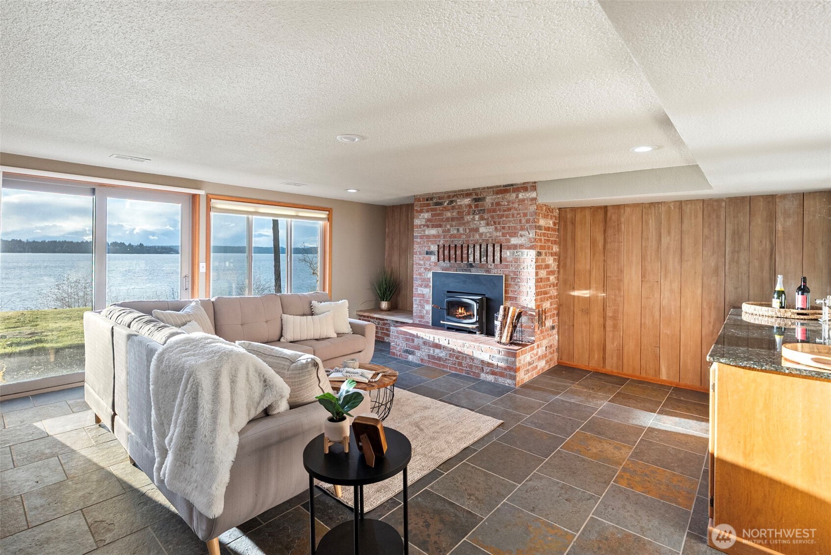 17510 88th Street Southwest Longbranch, WA 98351 - Photo 28 of 40 a living room with furniture and a fireplace