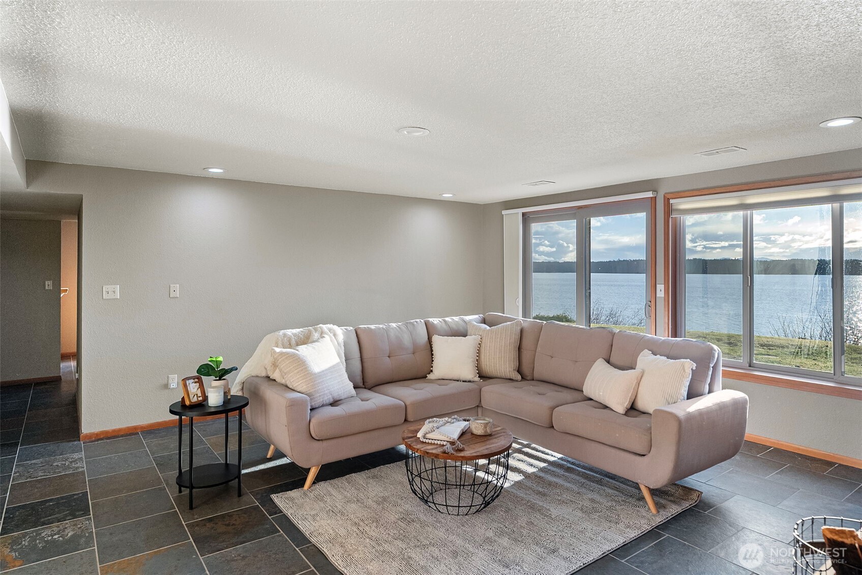 17510 88th Street Southwest Longbranch, WA 98351 - Photo 29 of 40 a living room with furniture and a large window