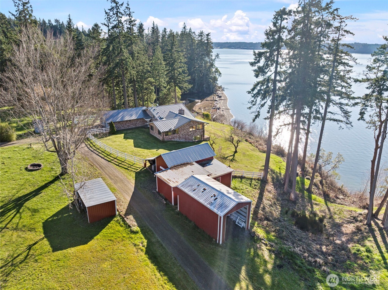 17510 88th Street Southwest Longbranch, WA 98351 - Photo 40 of 40 a aerial view of a house with swimming pool and large trees