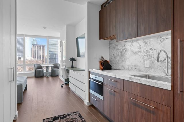 a kitchen with a sink and cabinets