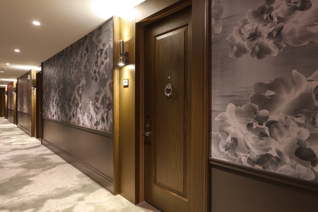 40 Trinity Place, Unit 1612 Boston, MA 02116 - Photo 13 of 38 a view of a hallway with paintings on the wall