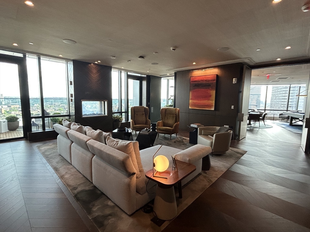 40 Trinity Place, Unit 1612 Boston, MA 02116 - Photo 20 of 38 a living room with furniture and a large window