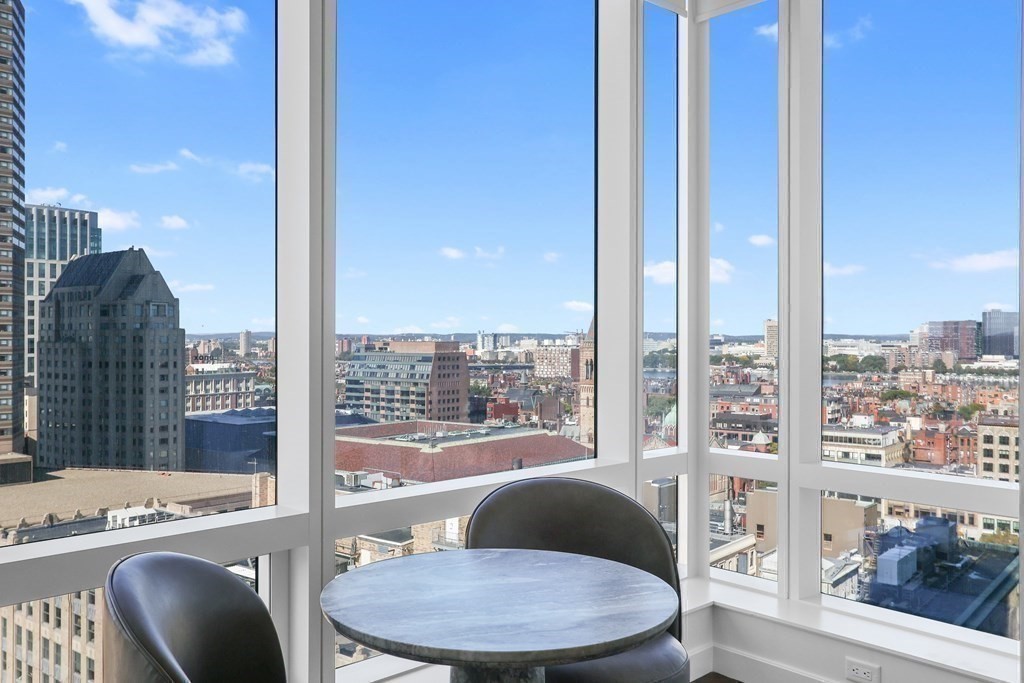 40 Trinity Place, Unit 1612 Boston, MA 02116 - Photo 2 of 38 a living room with furniture and a floor to ceiling window