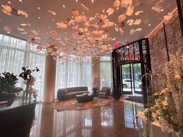a view of a lobby with black carpet