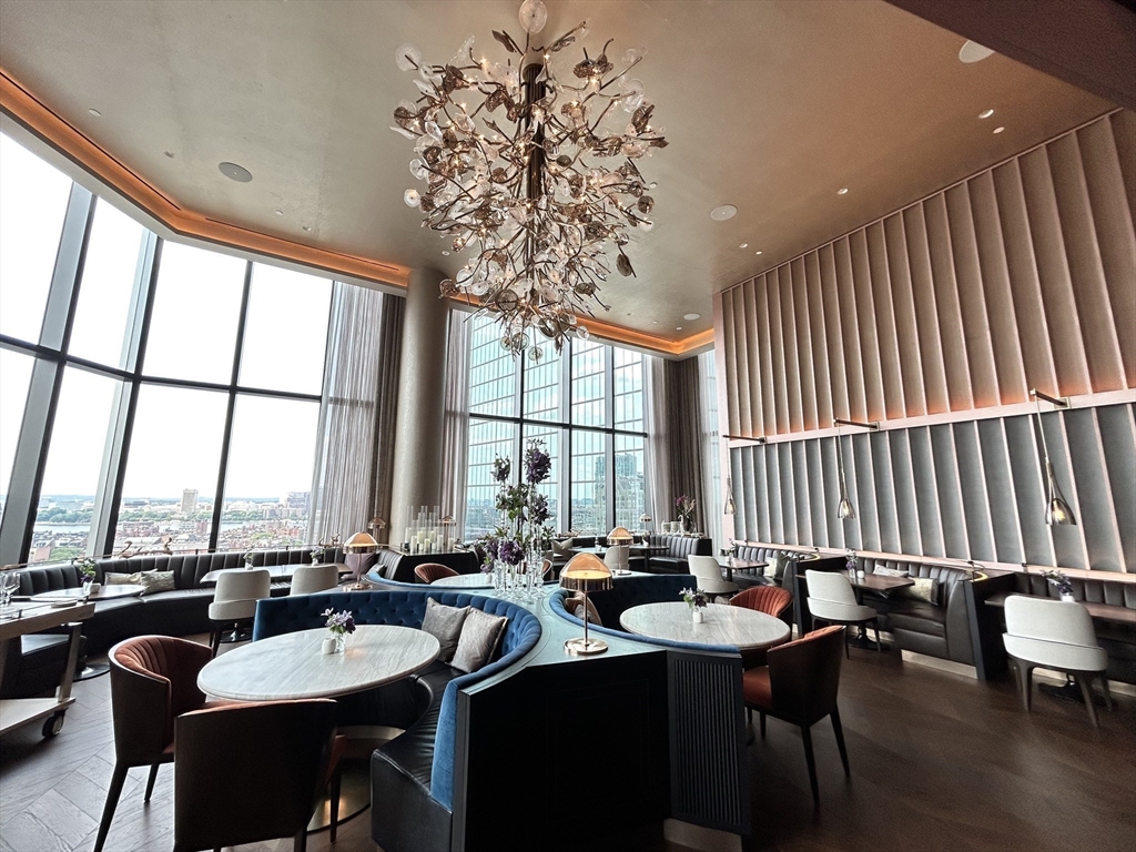 40 Trinity Place, Unit 1612 Boston, MA 02116 - Photo 31 of 38 a dining room with furniture a chandelier and wooden floor