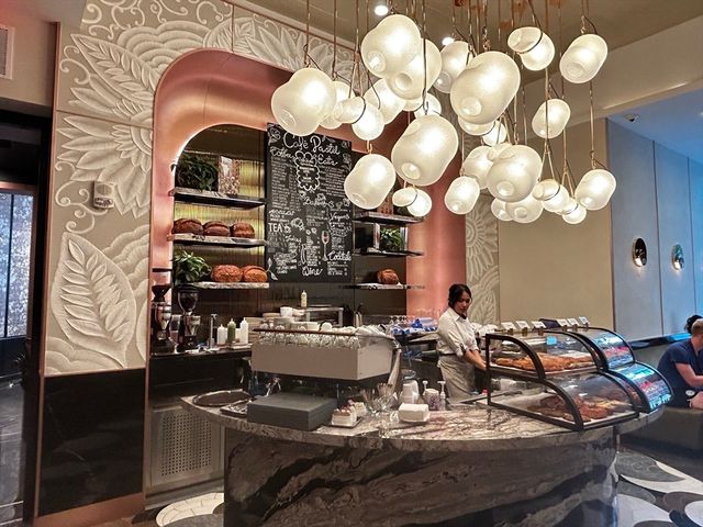 a dining room with furniture and a chandelier