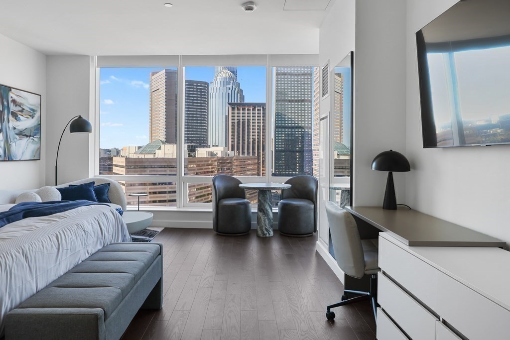 40 Trinity Place, Unit 1612 Boston, MA 02116 - Photo 5 of 38 a living room with furniture and a large window