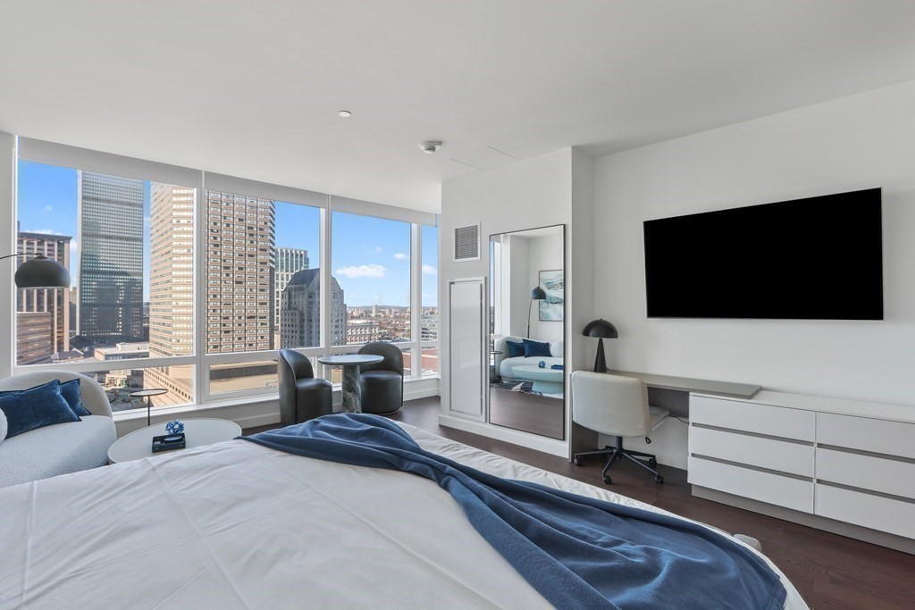 40 Trinity Place, Unit 1612 Boston, MA 02116 - Photo 10 of 38 a bedroom with a bed and a flat screen tv
