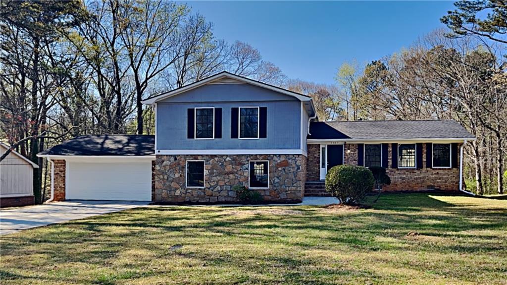 3007 Albatross Lane Decatur, GA 30034 - Photo 1 of 1 a front view of a house with a garden