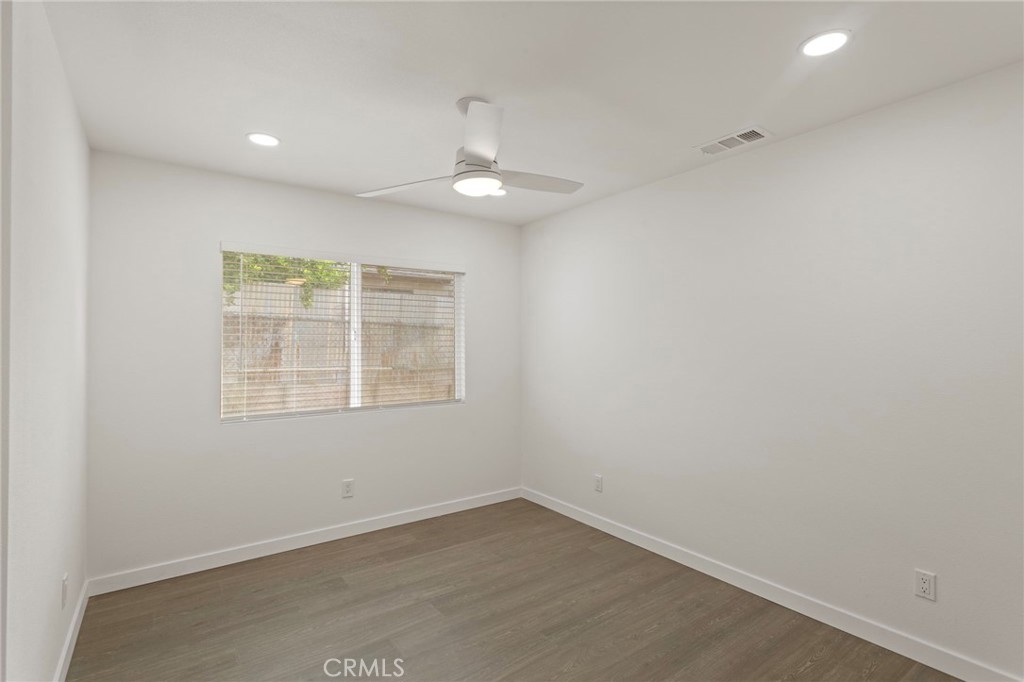 9219 Colorado Avenue Riverside, CA 92503 - Photo 18 of 30 an empty room with a window and chandelier fan