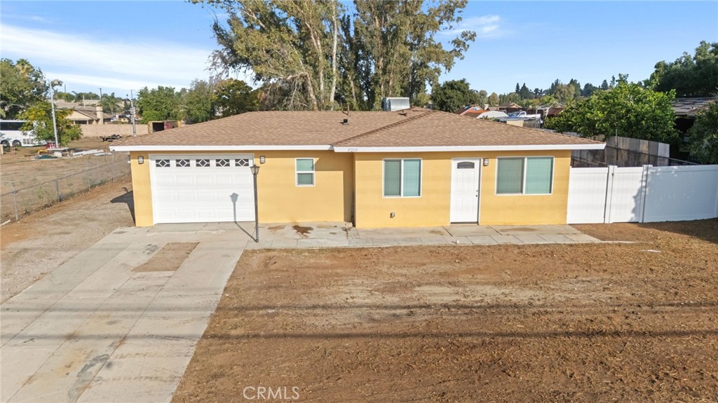 9219 Colorado Avenue Riverside, CA 92503 - Photo 2 of 30 a front view of a house with a yard and garage