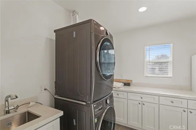 a kitchen with a sink and a refrigerator