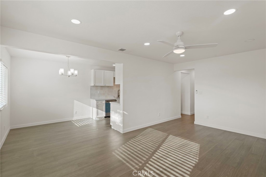 9219 Colorado Avenue Riverside, CA 92503 - Photo 10 of 30 an empty room with wooden floor and windows