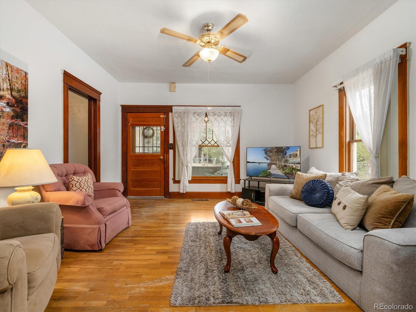 708 7th Street Fowler, CO 81039 - Photo 12 of 17 a living room with furniture and a large window