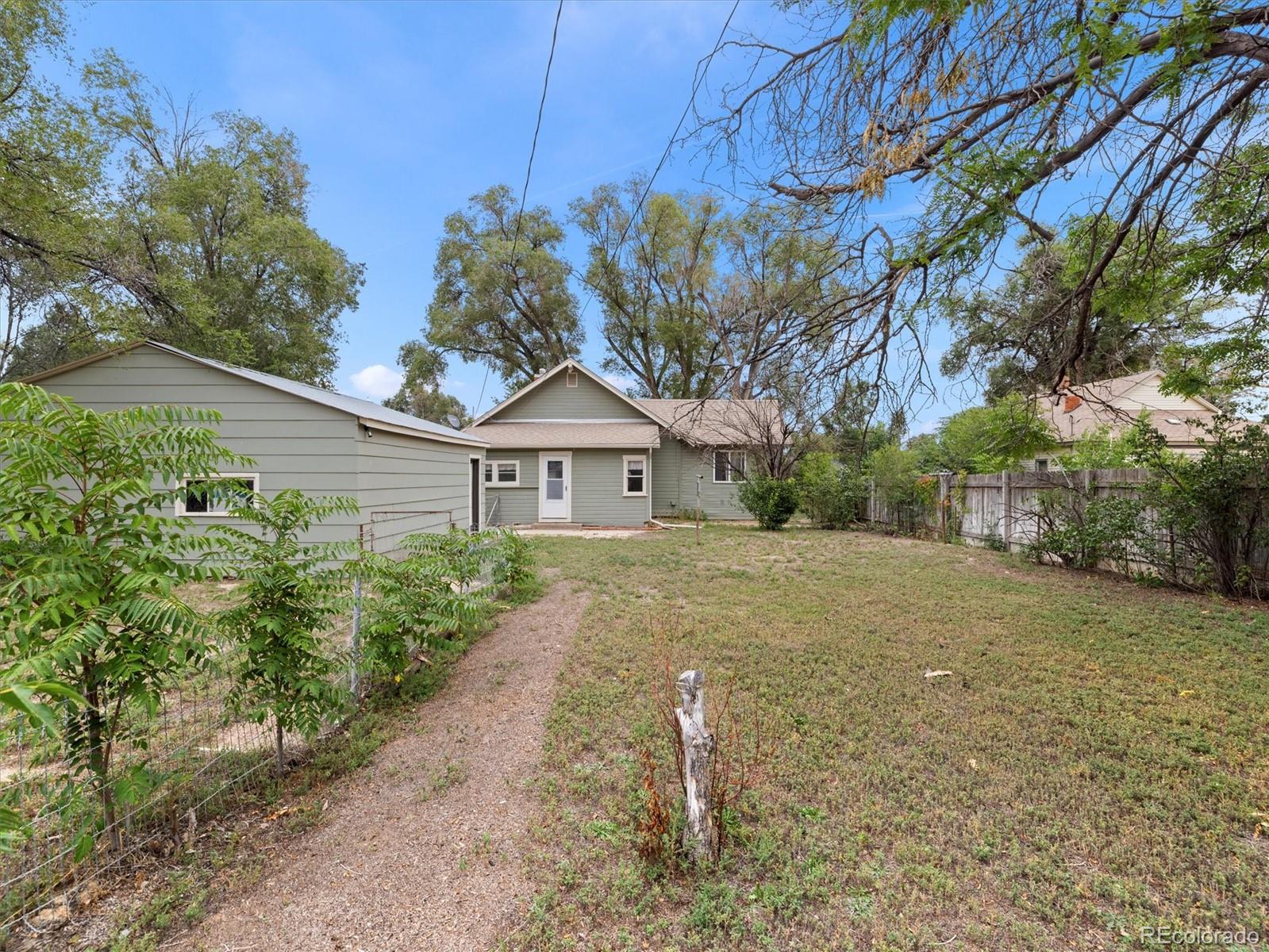 708 7th Street Fowler, CO 81039 - Photo 8 of 17 a front view of a house with garden