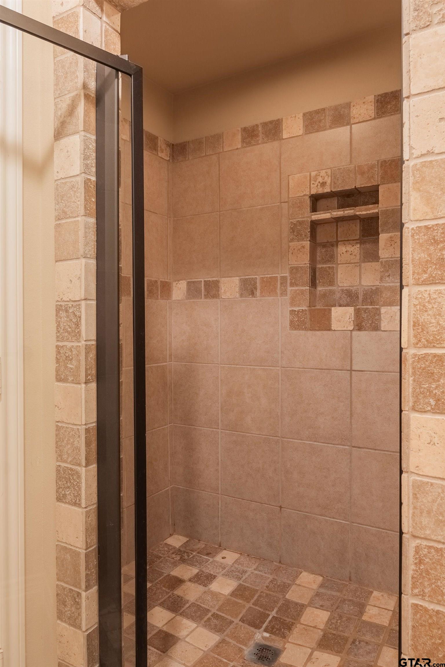 421 West Cumberland Road, Unit 703 Tyler, TX 75703 - Photo 22 of 29 a bathroom with a shower