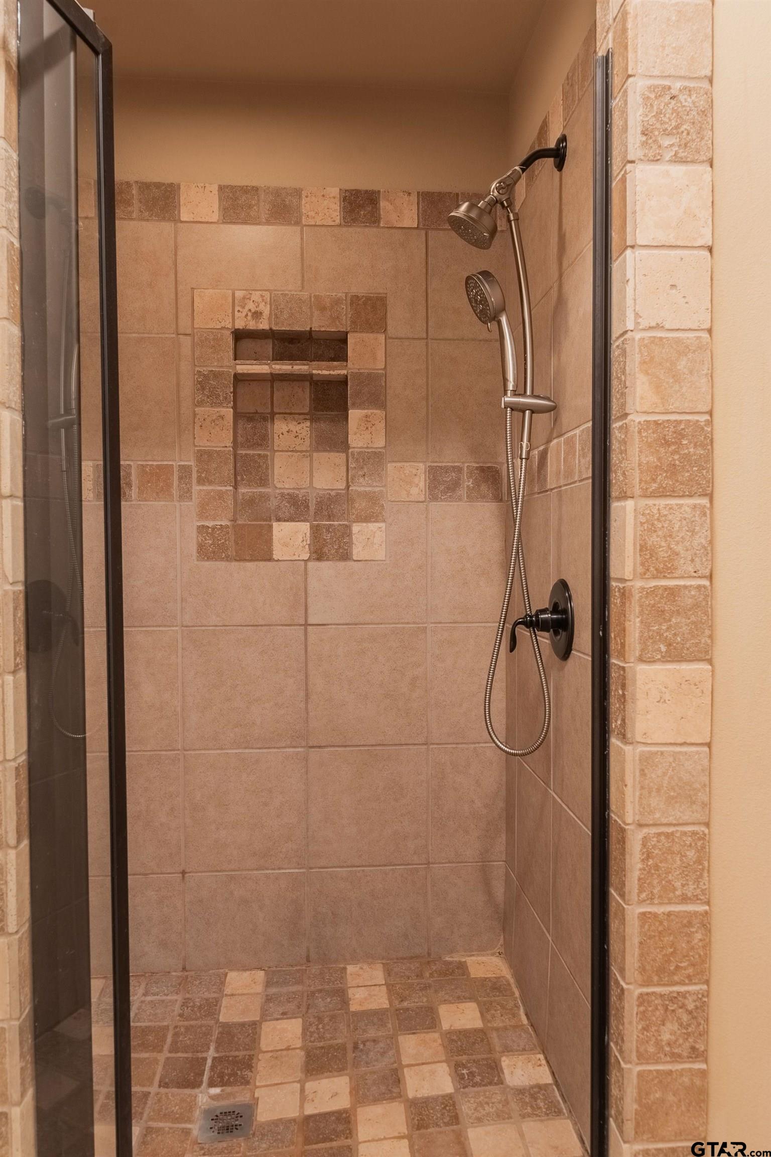 421 West Cumberland Road, Unit 703 Tyler, TX 75703 - Photo 23 of 29 a bathroom with a shower
