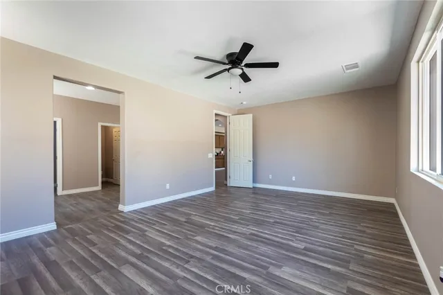 a spacious bathroom with a double vanity sink a mirror and a bathtub